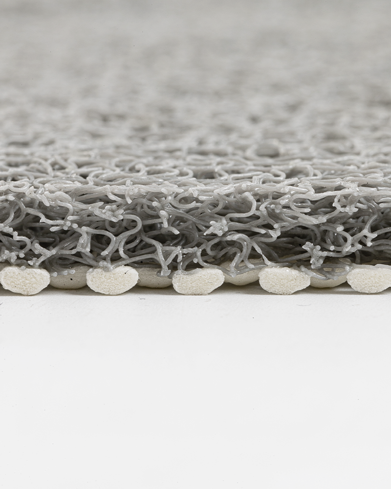 Shower mat with PVC loofah texture, quick-drying, soft and non-slip.