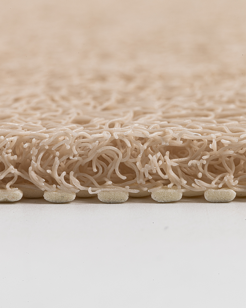 Non-slip PVC loofah shower mat, soft textured surface, ideal for wet areas.