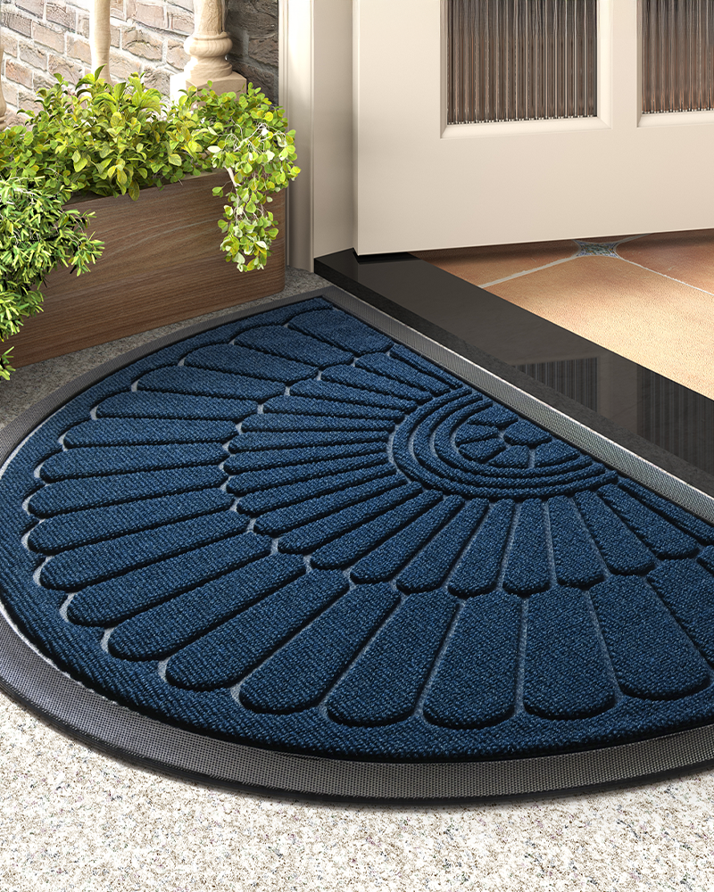 Water absorbent half moon entryway mat with rubber back and feather texture.