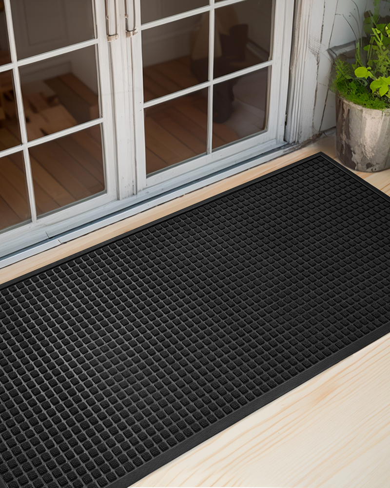 Non-slip welcome mat for outside entrance made of heavy-duty rubber.