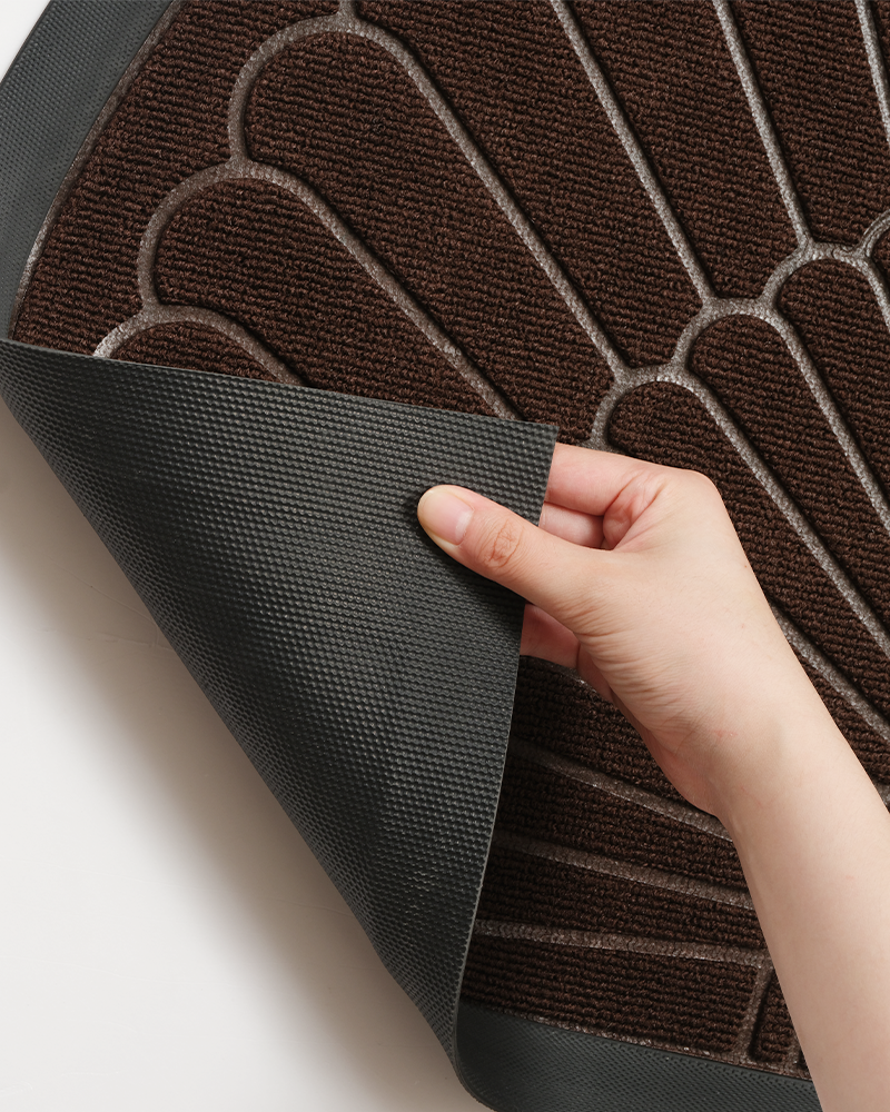 Durable semicircular front door rug with heavy-duty rubber backing for entryway.