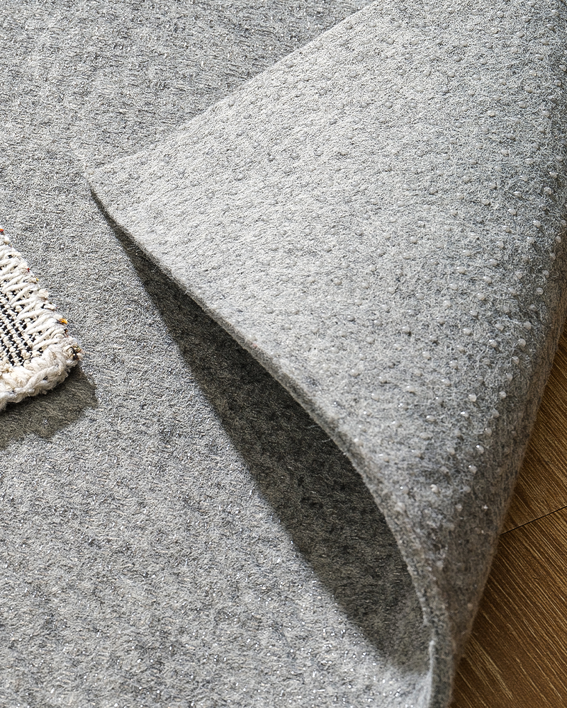 Thick felt rug pad for hardwood floors, non-slip cushioning for 10x10 area rugs.