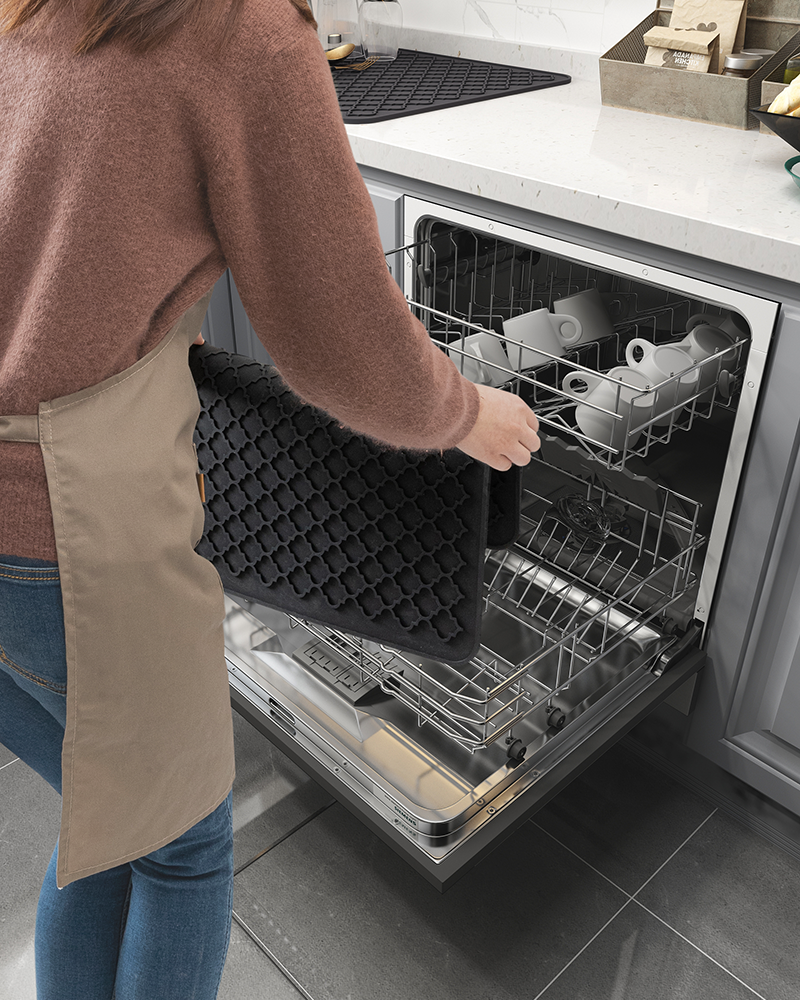 Sink area silicone drying mat with textured surface to enhance drainage and airflow.