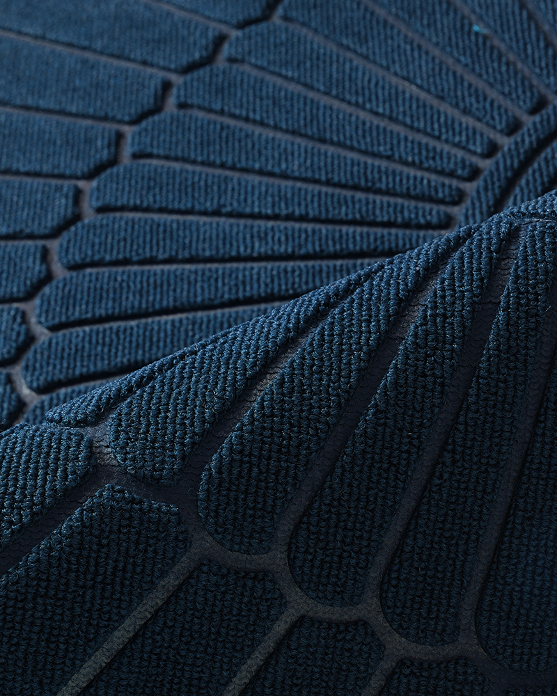 Semicircular welcome mat for entryway with molded rubber border and low profile.