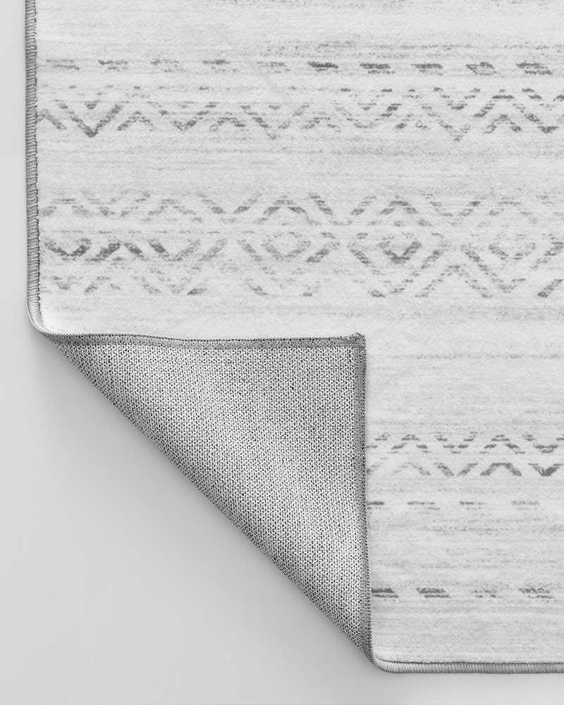 Neutral Moroccan rug with soft touch and fluffy surface enhancing floor comfort.