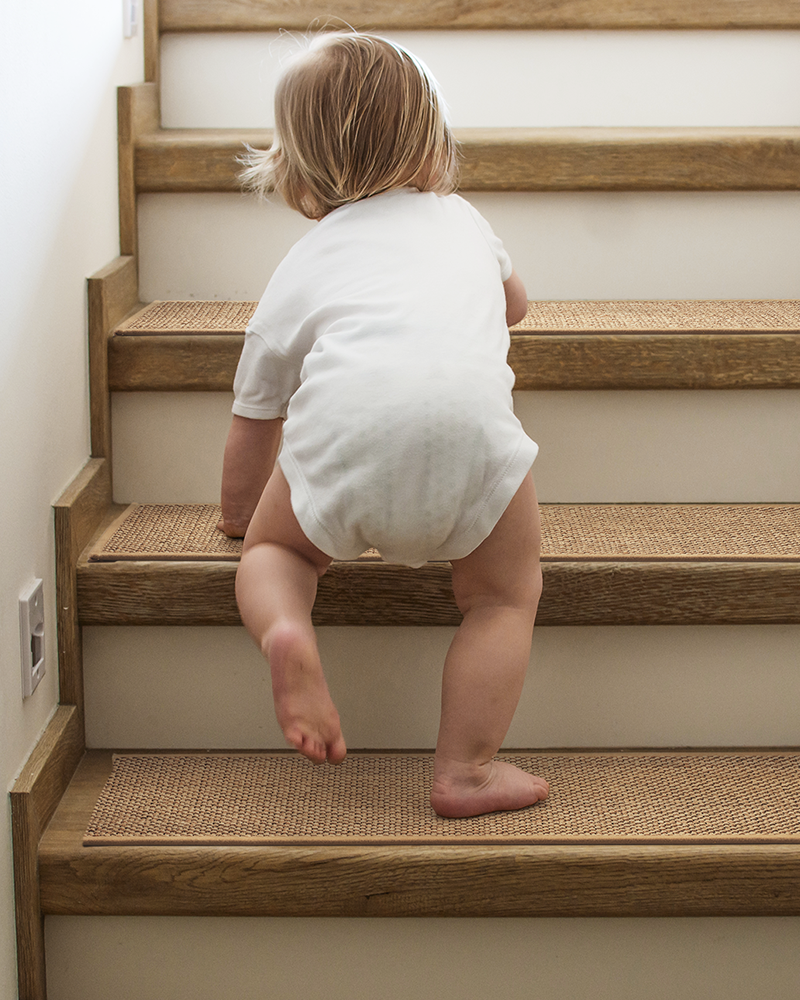 Residue free carpet stair treads protect wooden steps from scratches and wear.