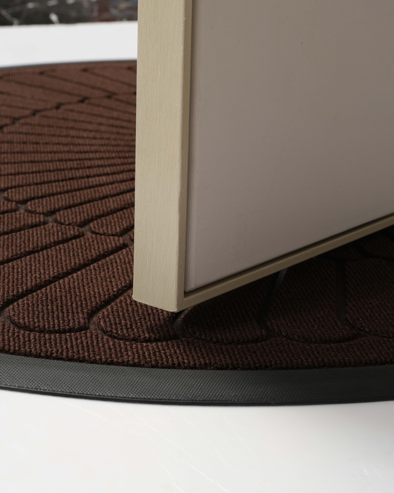 Durable outdoor half-round door mat with non slip design for entryway.