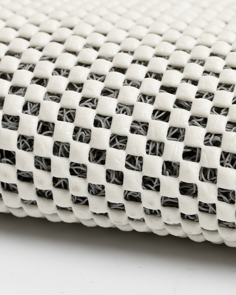 Non-slip PVC loofah bathroom mat, durable and easy to maintain.