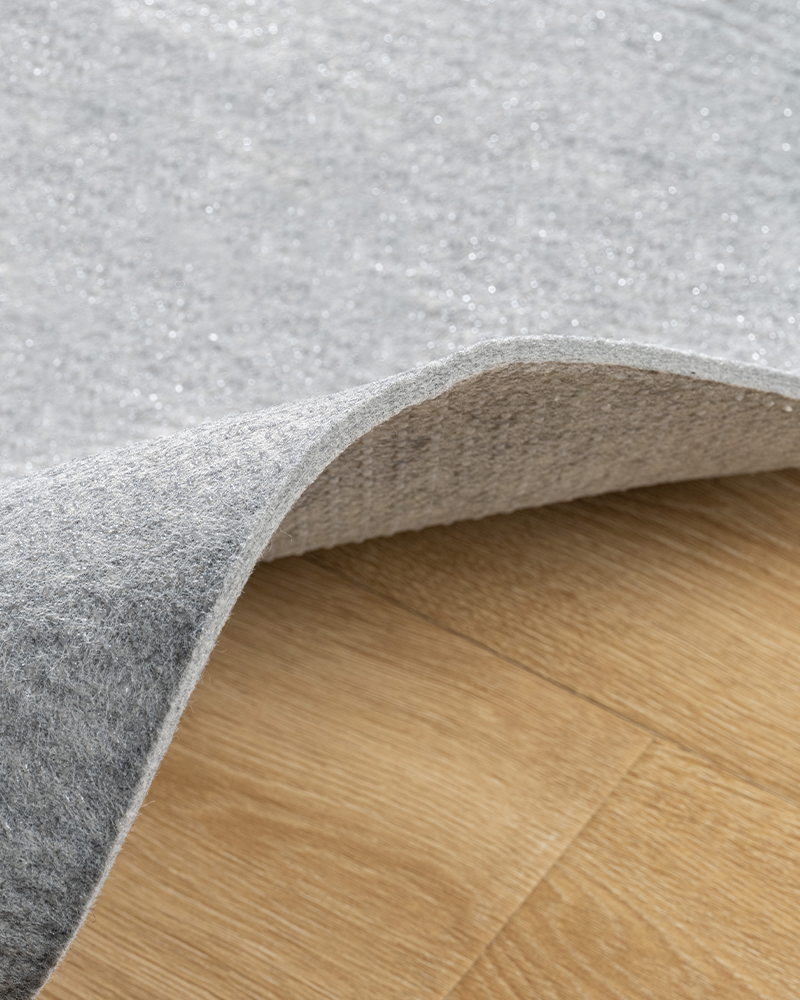 Thick felt rug pad under area rugs, non-slip protection for tile or wood floors.