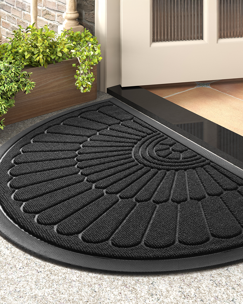 Waterproof semicircular entry mat with rubber backing and non slip texture.