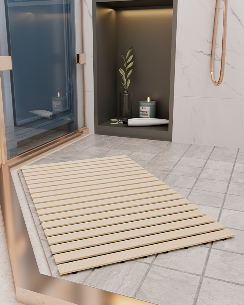 Curlable heavy-duty shower mat, non-slip with rubber feet and quick drainage.