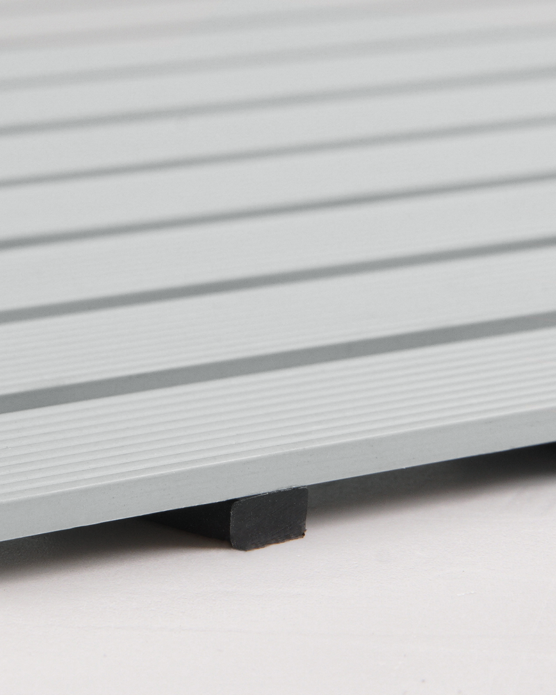 Heavy-duty shower mat, safe, non-slip with rubber backing for indoor/outdoor use.