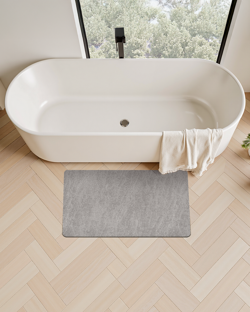 Soft bath mat with rubber backing, safe and absorbent surface for bathroom floor.