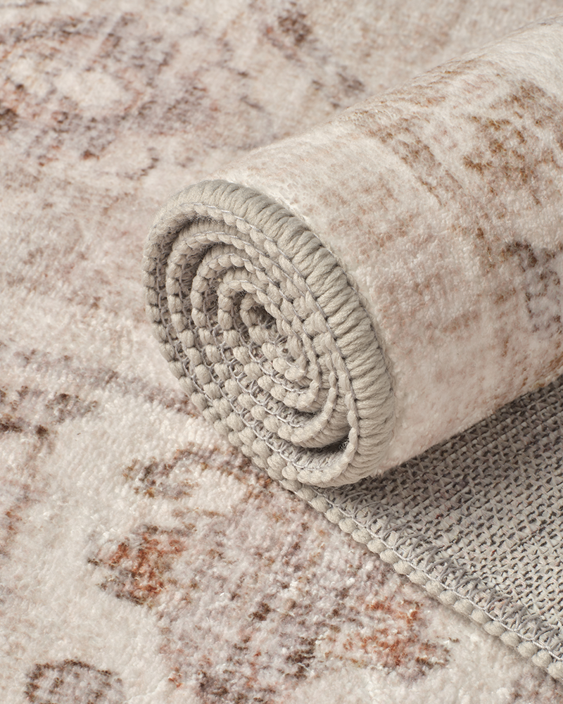 Washable beige area rug blends modern decor and soft comfort.