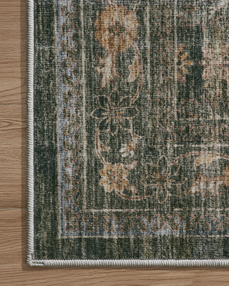 Cozy washable green vintage rug for living room, warm and elegant design.