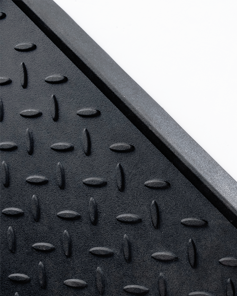 Waterproof rubber dirt trapper mat for entryway shoe storage.