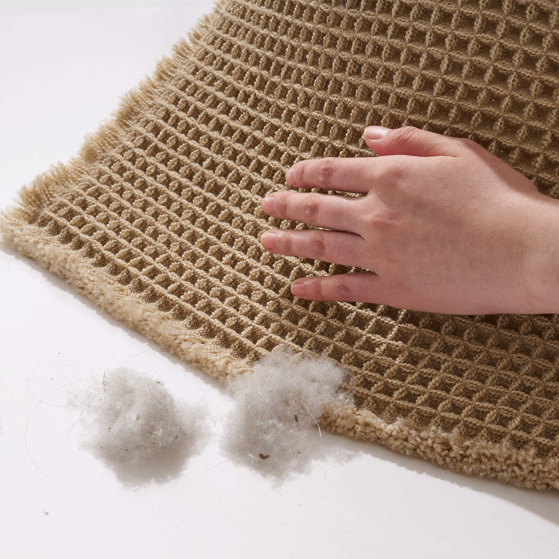 Absorbent waffle bath mat designed for easy care with machine washable convenience