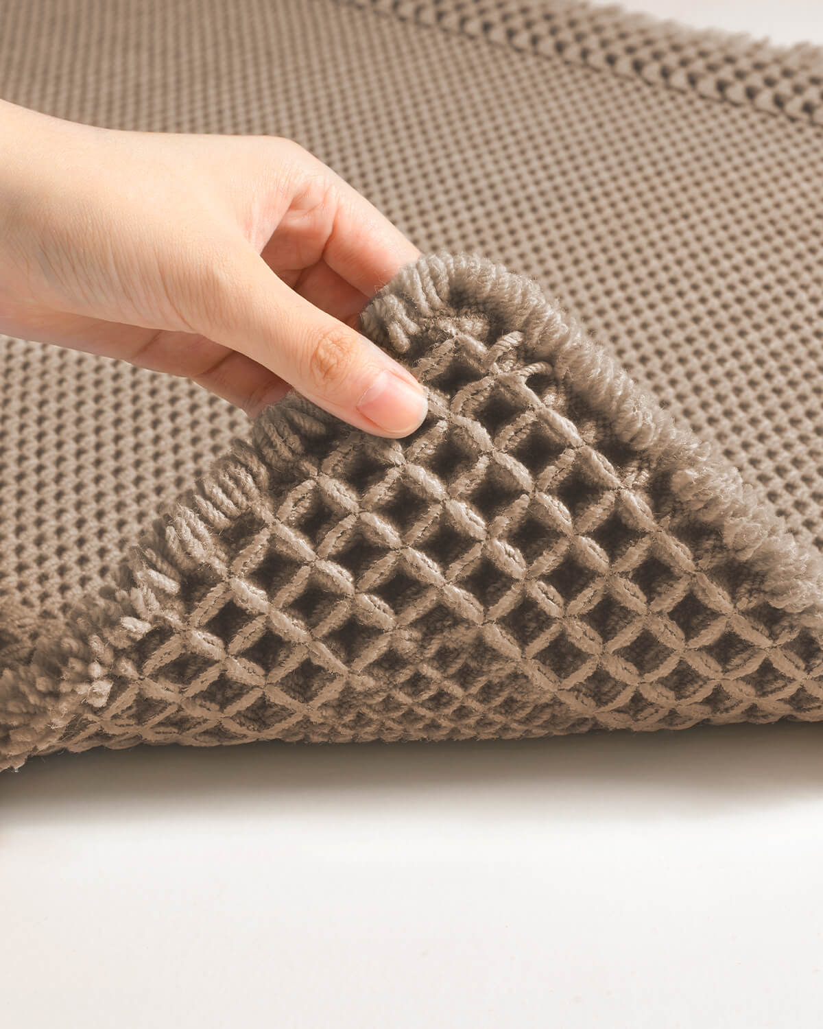 Absorbent waffle bath rug with soft cushioned feel underfoot