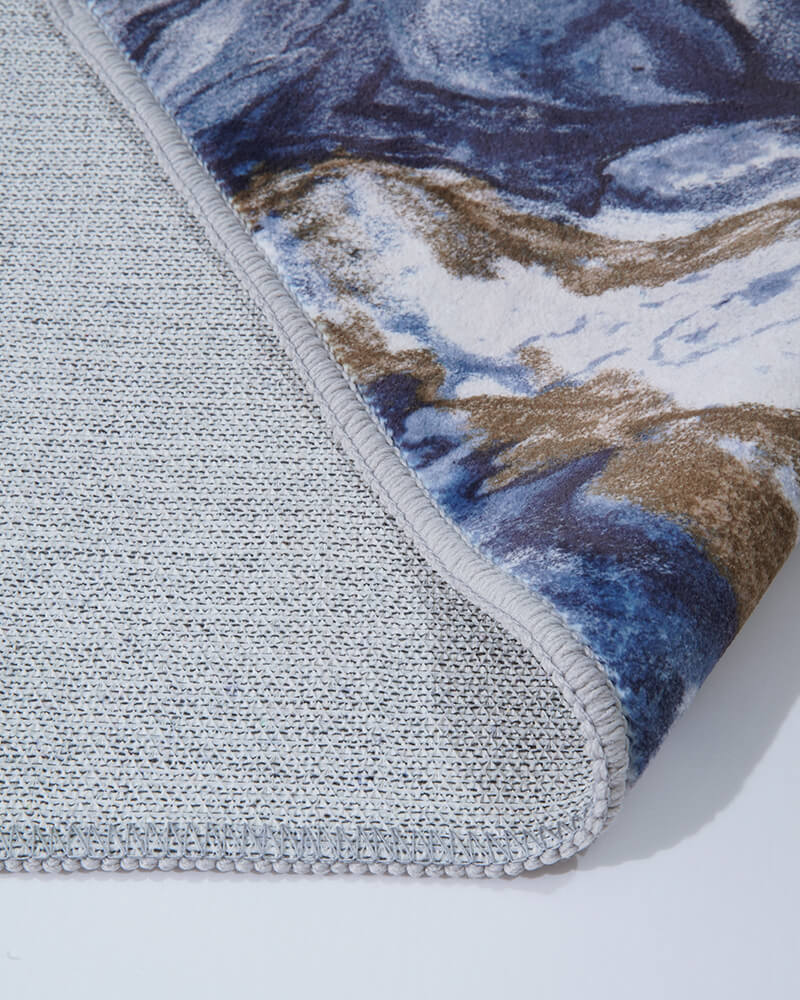 Modern area rug designed to soften hard surface floors with gentle comfort.