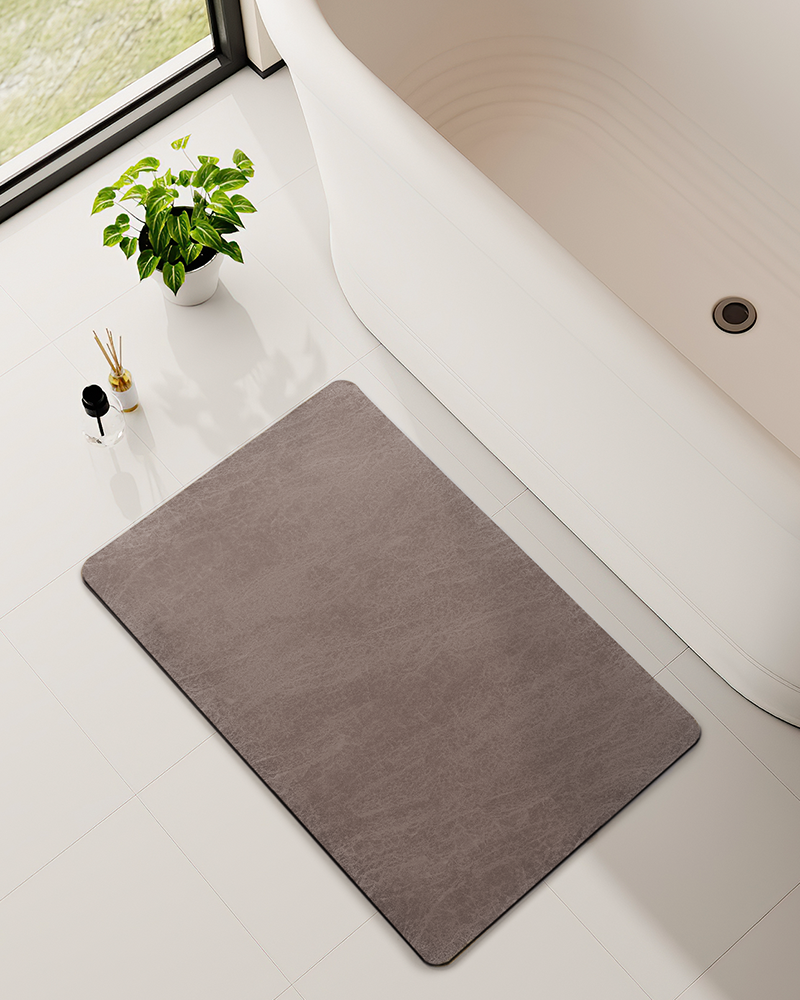 Bath mat designed to keep bathrooms clean, dry, and organized with fast drying and low profile construction
