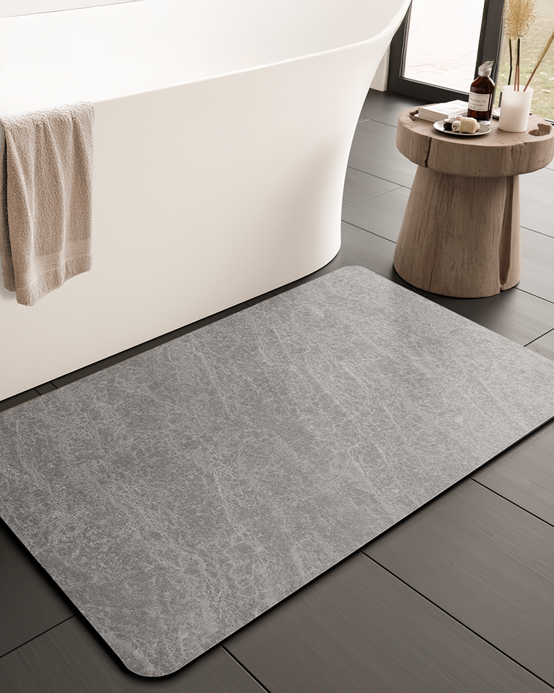 Bath mat designed for low maintenance bathroom care, featuring a smooth surface that wipes clean and dries quickly