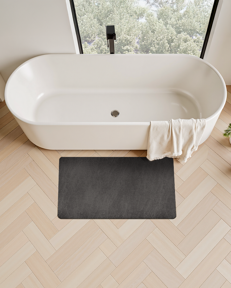 Bath mat with durable rubber backing that prevents shifting on wet floors and improves bathroom safety for daily use