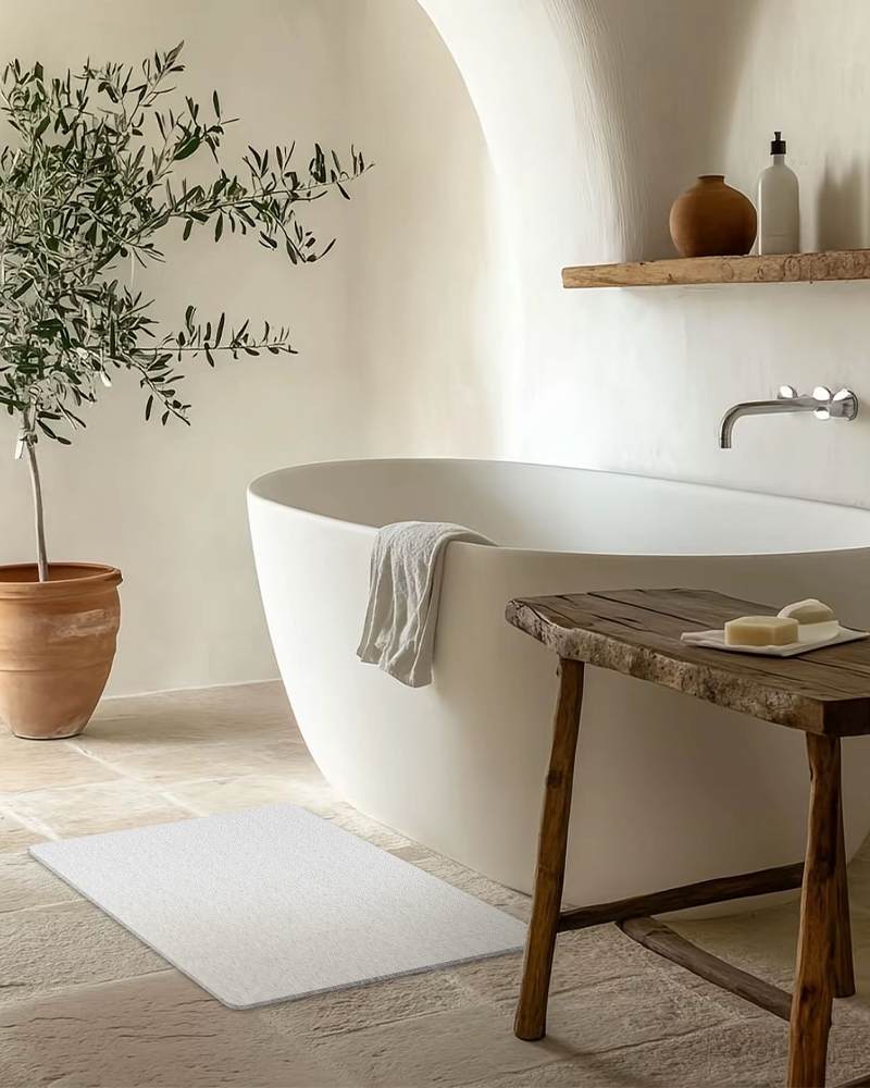 PVC bath mat with secure grip backing that helps prevent slipping in busy family bathrooms