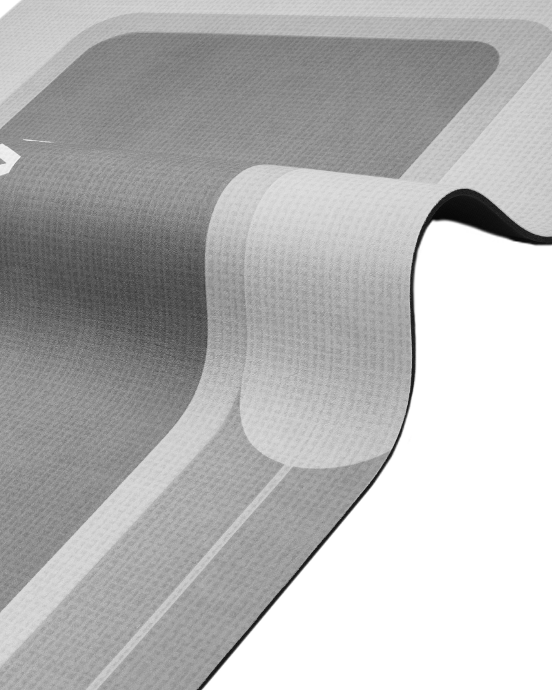 Bathroom mat with durable rubber backing that stays flat without curling, even on smooth wet tile