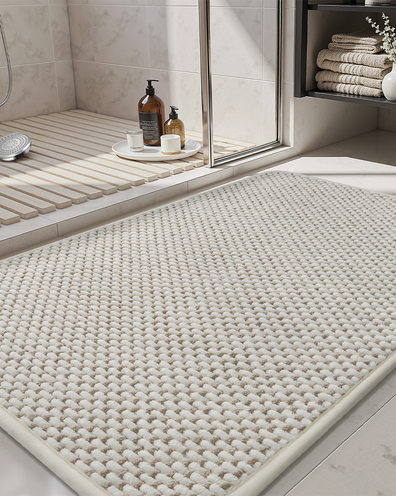 Beige and white chenille bath rug, low-pile, durable, and quick-drying for daily use.