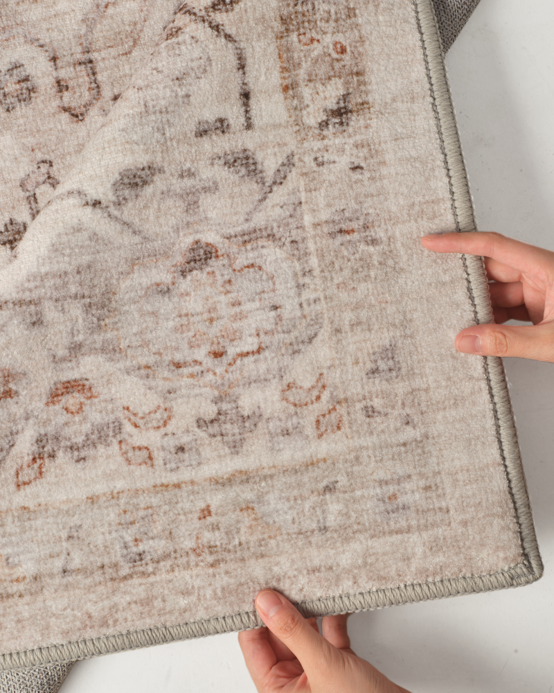 Boho area rug with thin profile and secure backing, suitable for bedroom, living room, hallways.