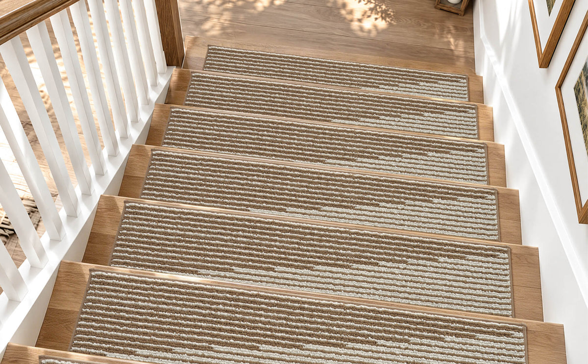 Brown and white striped non-slip stair treads neatly line a sunlit wooden staircase, featuring a soft ribbed woven texture, neatly bound edges, and a warm linear pattern that provides comfortable footing, helps protect hardwood steps, and adds cozy, timeless style to family-friendly home interiors.