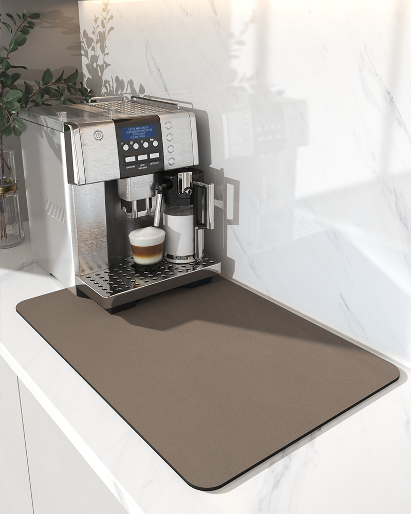 Coffee machine mat placed under a coffee maker to keep counters dry