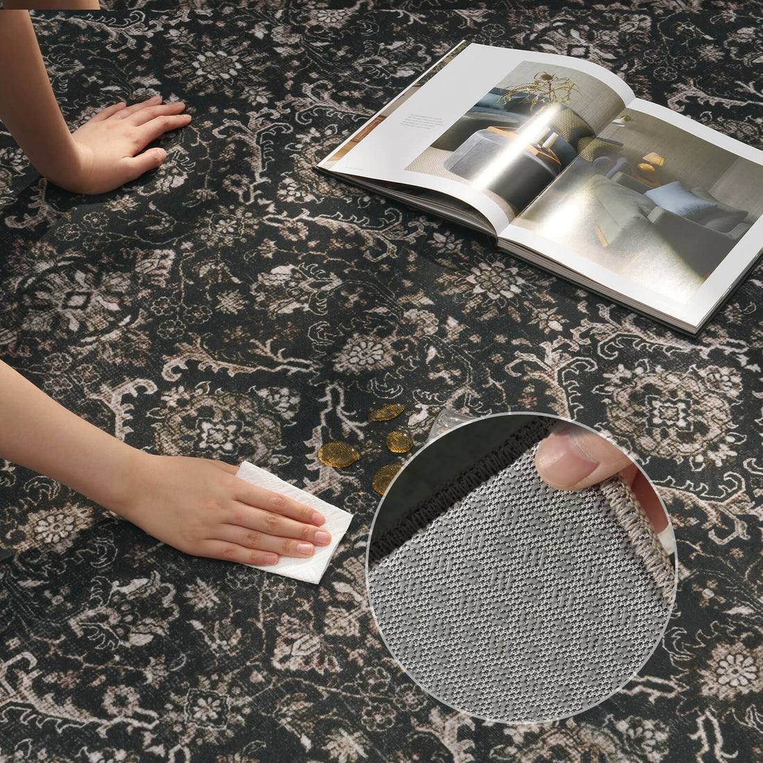 A dark charcoal vintage washable area rug is shown being wiped clean, highlighting its easy-care surface, detailed ornamental pattern, and gray backing inset for everyday living rooms, bedrooms, and busy family homes.