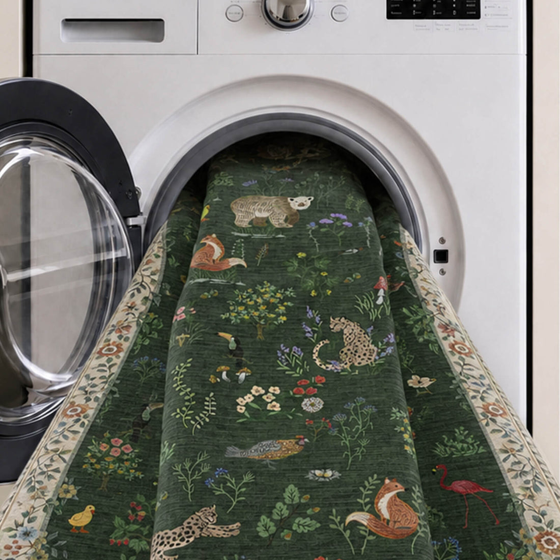 A dark green soft kids rug is shown in a washing machine, featuring cute forest animals, birds, flamingos, mushrooms, and floral border details with a gentle comfortable surface and easy-care design for nurseries, playrooms, and children’s bedrooms.