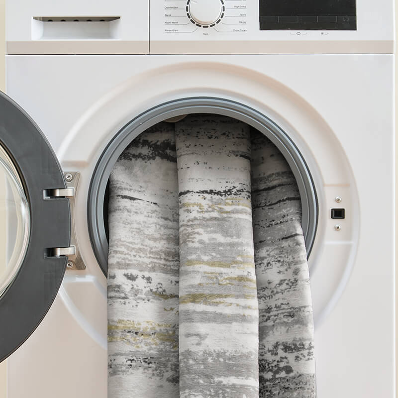 Dawn washable area rug with machine washable material.