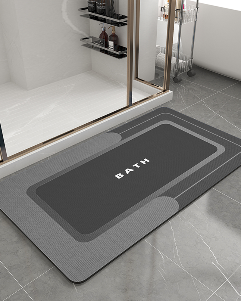 Rubber-backed non-slip bath mat with quick-dry and absorbent surface, perfect for everyday use.