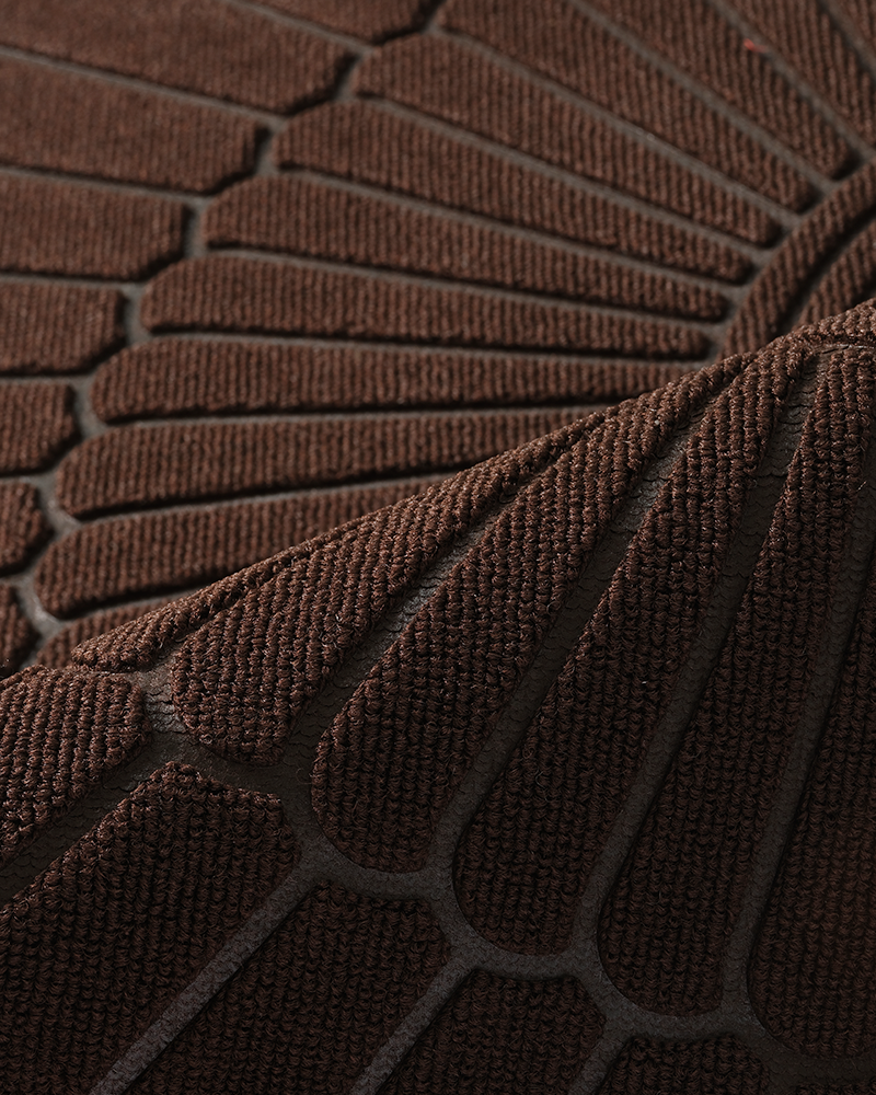 Entryway mat that lays flat without curling or cracking