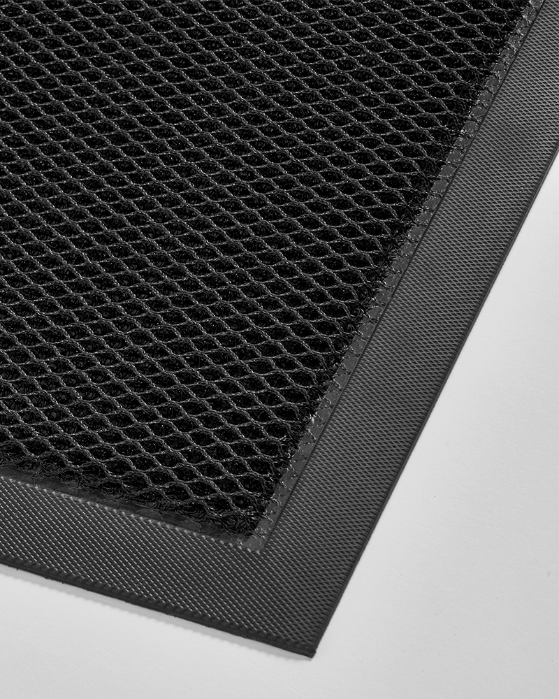 Entryway mat that prevents slipping and shifting on smooth floors