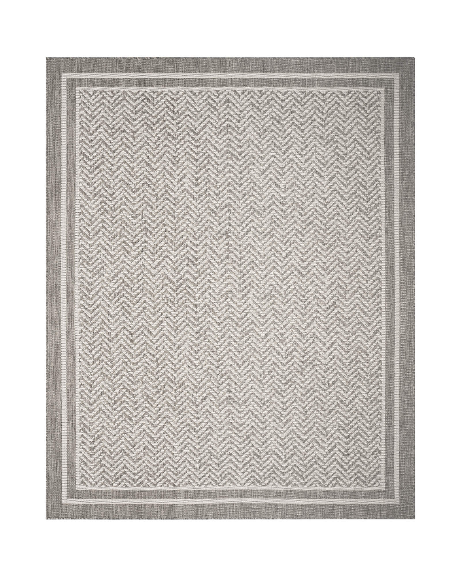 A gray chevron indoor outdoor rug features a durable woven texture and subtle border design, adding easy-care style to patios, porches, dining areas, living rooms, and high-traffic spaces.