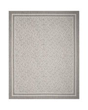 A gray chevron indoor outdoor rug features a durable woven texture and subtle border design, adding easy-care style to patios, porches, dining areas, living rooms, and high-traffic spaces.