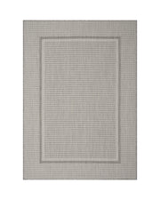 A gray woven indoor outdoor rug features a durable jute-look texture and subtle border design, adding easy-care style to patios, porches, sunrooms, dining areas, and high-traffic living spaces.