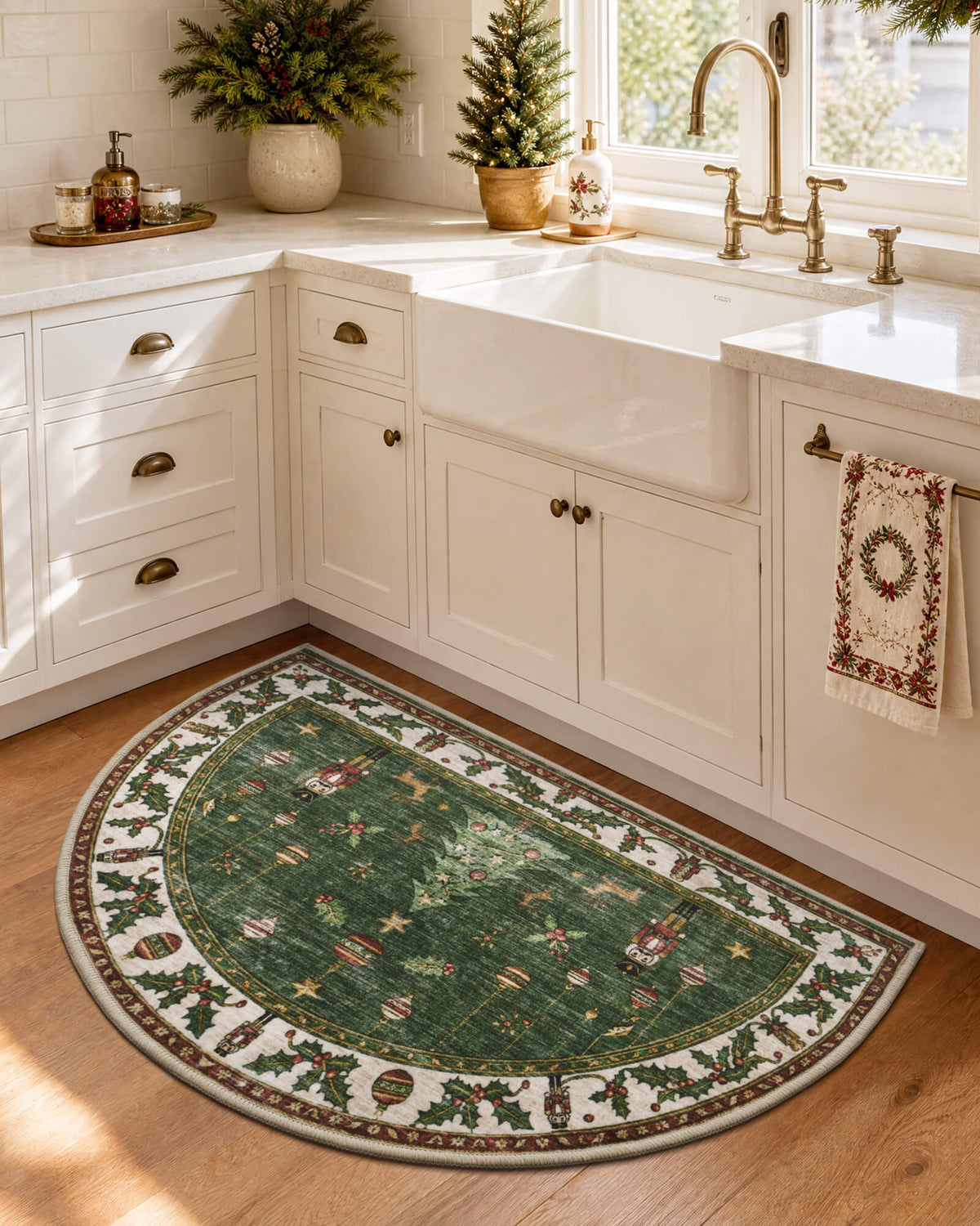 A green Christmas washable half-round kitchen rug features festive nutcracker soldiers, hanging ornaments, golden stars, and an ornate holly berry border, bringing vintage holiday charm and cozy seasonal warmth to a bright farmhouse kitchen with white cabinets, a farmhouse sink, and Christmas decorations.