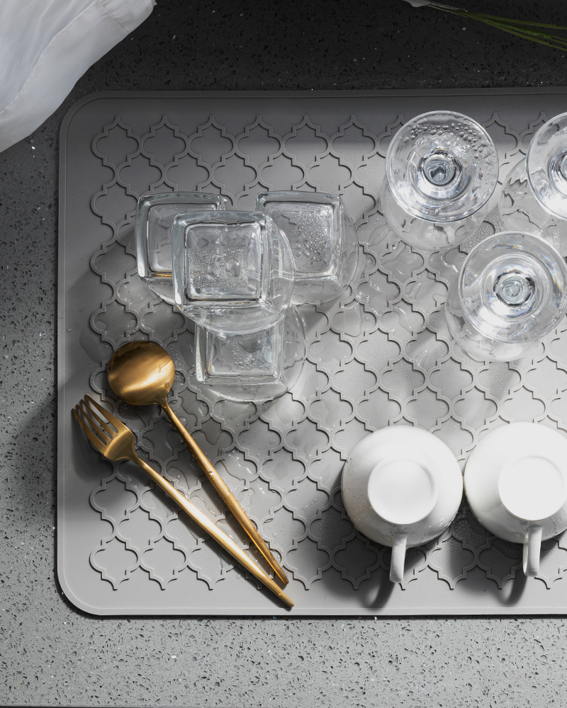 Silicone drying mat supporting dishes cups and everyday kitchenware