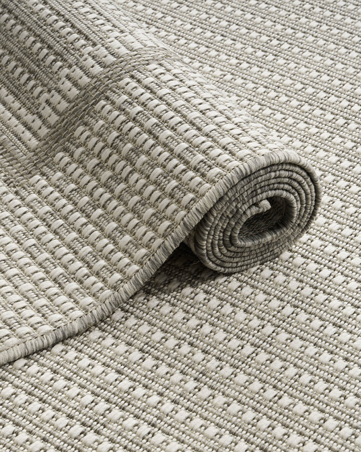 Washable textured indoor outdoor rug suitable for modern homes and outdoor living