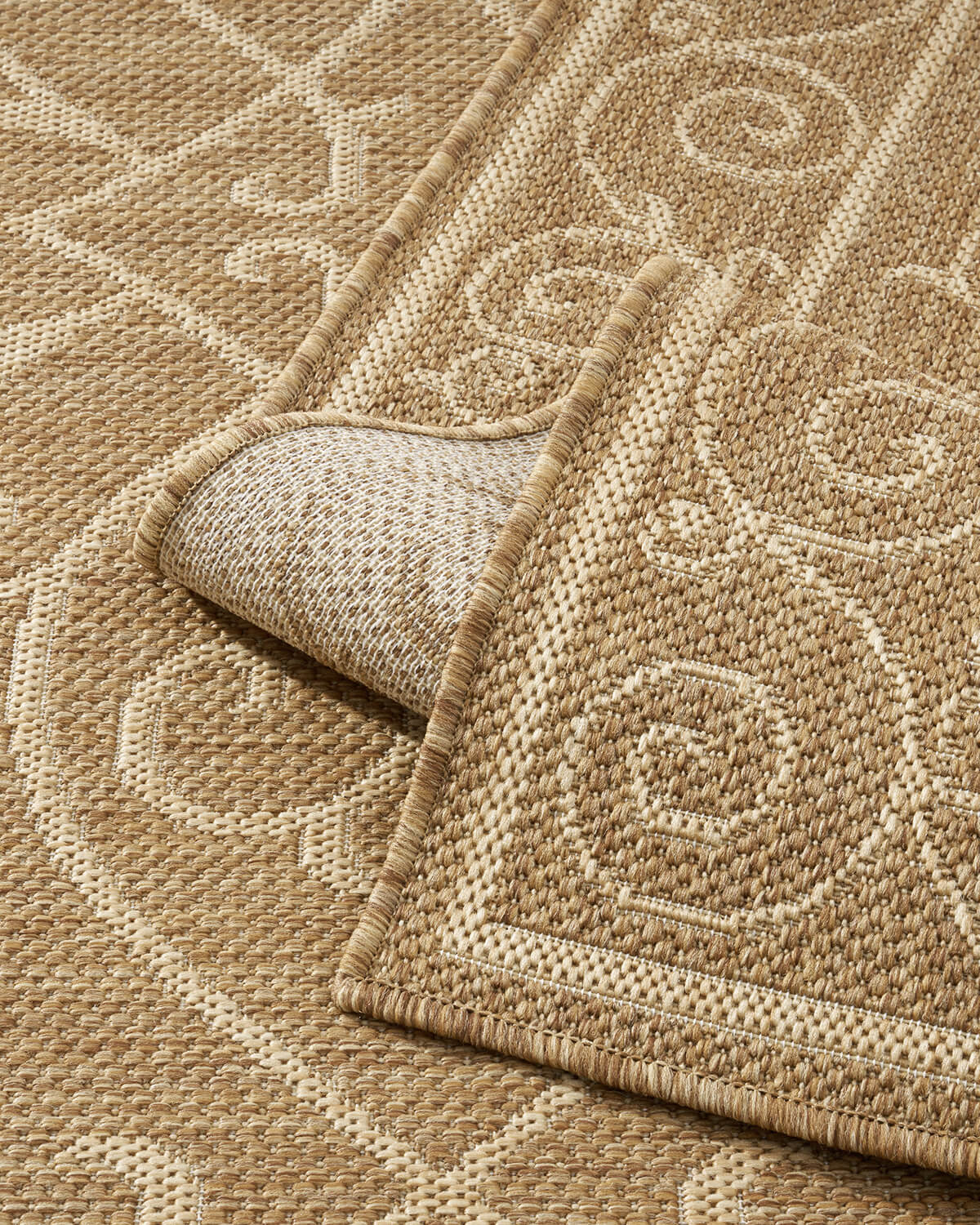 Indoor outdoor rug offering versatile placement across home and outdoor environments