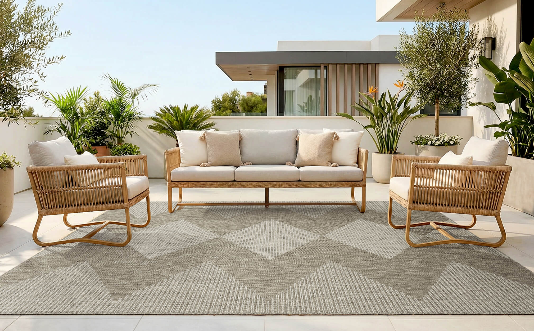 This indoor outdoor rug brings a clean grounded look to a patio coffee area with durable construction and easy clean maintenance.