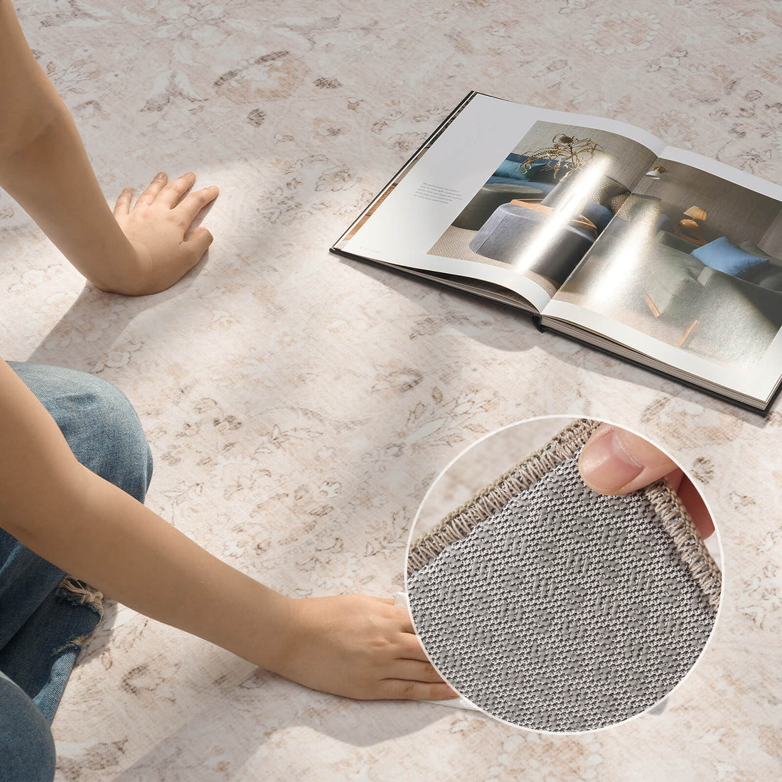 An ivory neutral vintage washable area rug is shown being wiped clean, highlighting its kid-friendly soft surface, subtle distressed pattern, gray backing detail, and easy-maintain design for everyday home use.