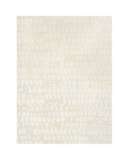 An ivory premium Wilton jacquard area rug features a raised pebble-inspired pattern, sculptural tonal texture, and refined woven depth for luxury living rooms, elegant bedrooms, and designer-inspired home decor.