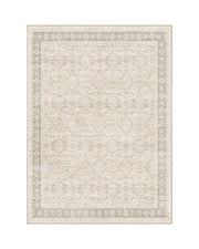 An ivory vintage washable area rug features a softly faded ornamental pattern, double border design, and low-pile texture for timeless living room, bedroom, and dining room decor.