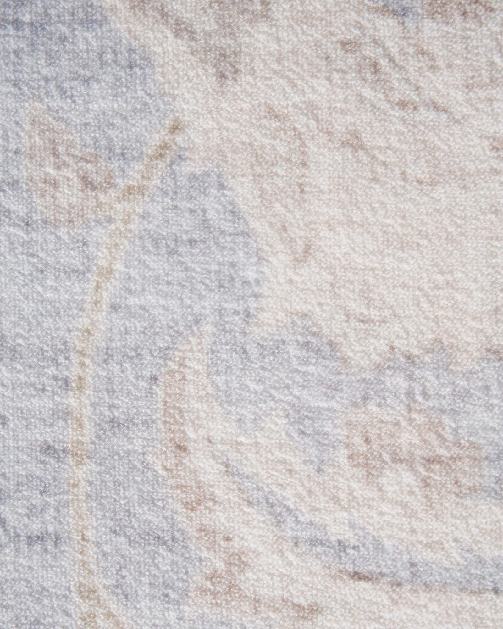 A close-up view of a light blue vintage washable rug showing its soft distressed ornamental texture, subtle neutral tones, and low-pile surface for cozy living rooms, bedrooms, and everyday home decor.